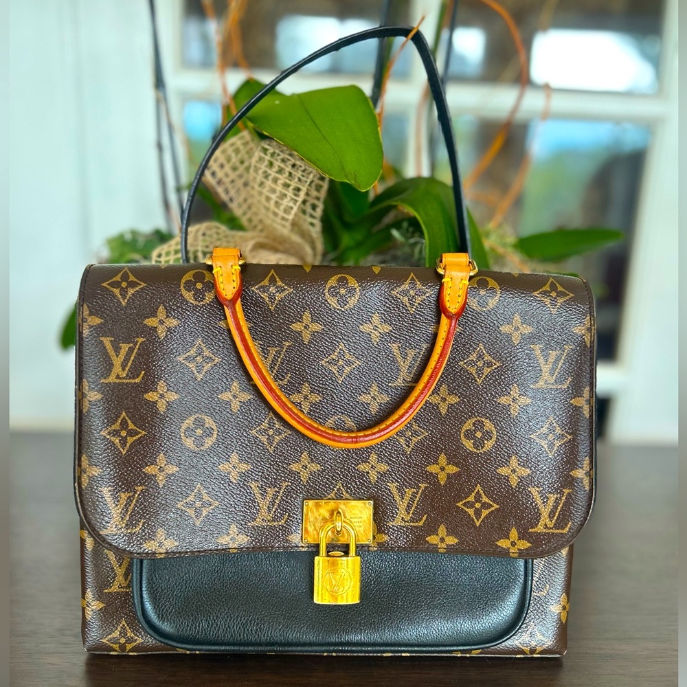 Louis Vuitton
Marignan Handbag Monogram Canvas with Leather $1600 - Picture 3 of 16